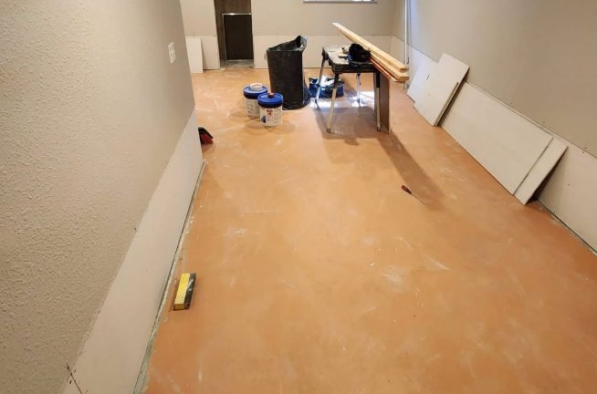Before: lower drywall removed after water damage