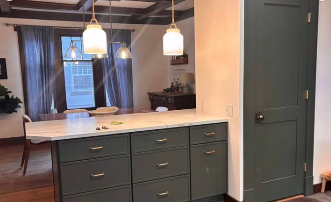 After: green cabinets and counter where the wall stood