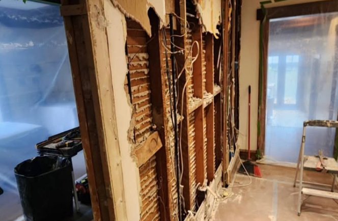 Before: plaster wall torn open