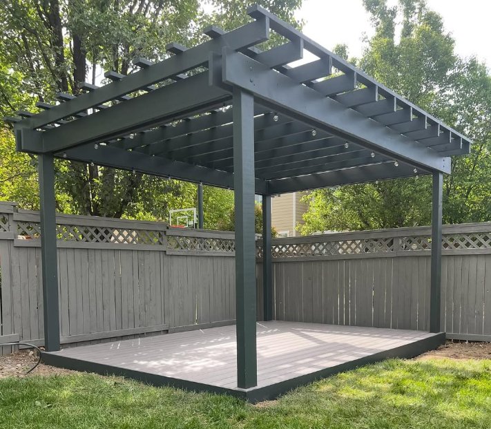 Backyard composite deck with a painted pergola
