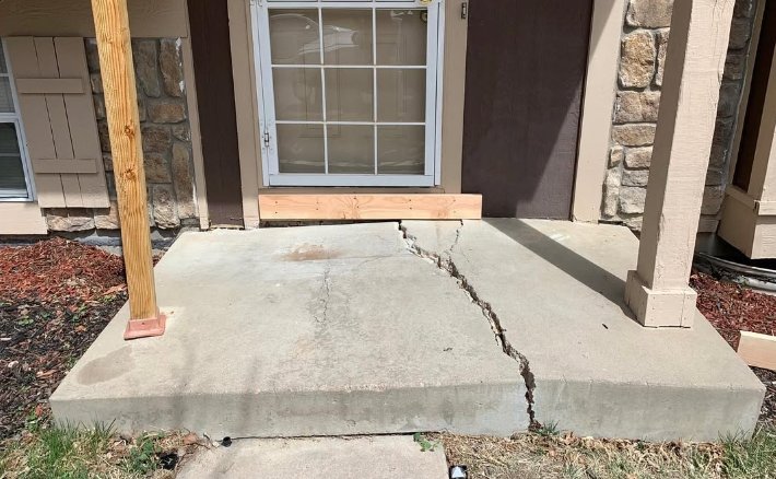 Before: cracked concrete front step