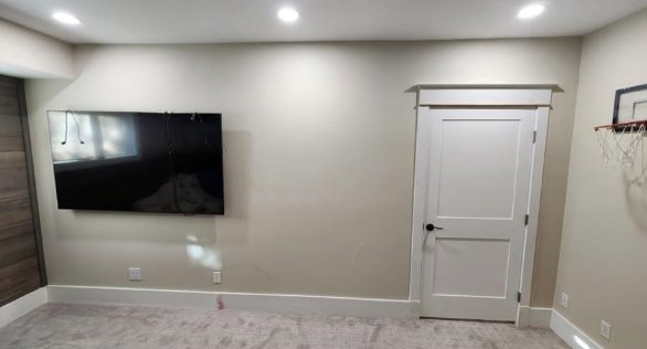 After: basement room with new door and trim